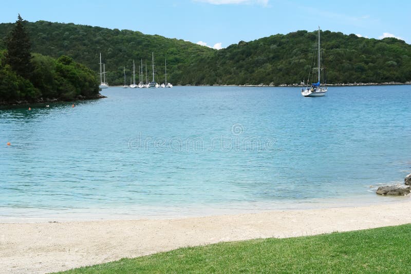 Bay with yachts in the Greek Ionian Sea.