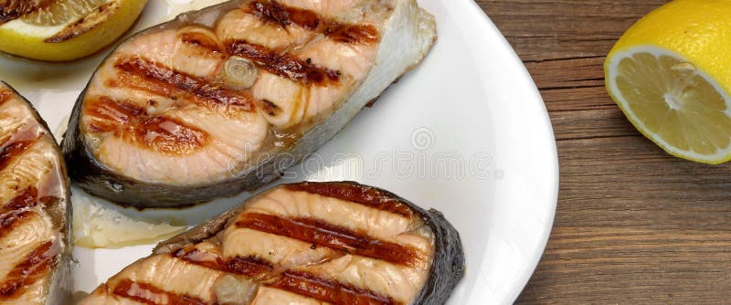 BBQ Grilled Salmon Steaks On The White Plate