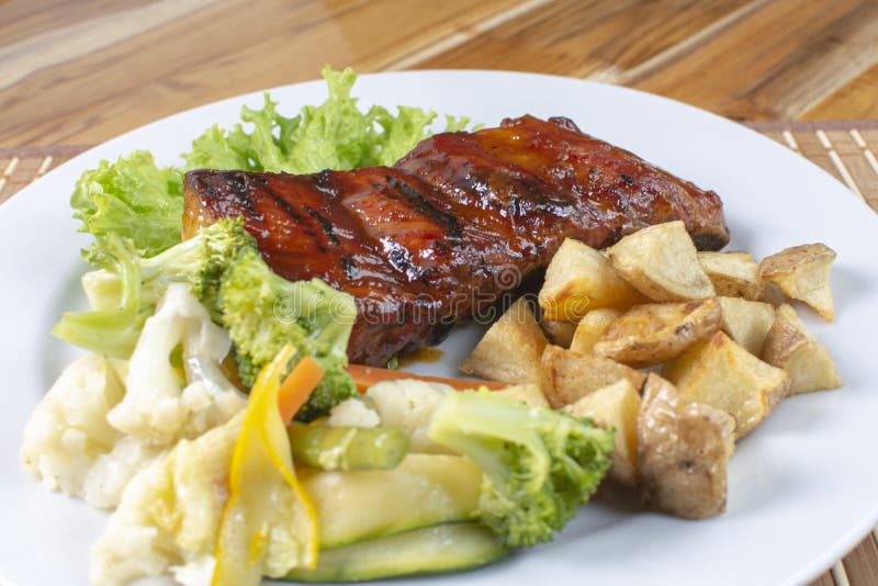 BBQ Rib with Arepa, Cassava and Onion and Vegetables Stock Photo