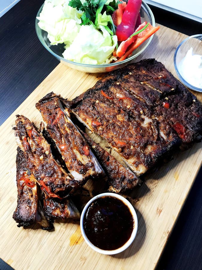 BBQ Ribs Marinated Pork Ribs with Barbeque Sauce Dip. Stock Image