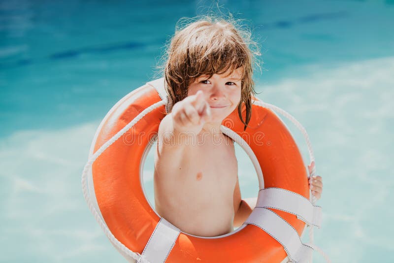 Be careful on water. Kids saving life. Helping concept. Child with rescue circle. Summer beach.