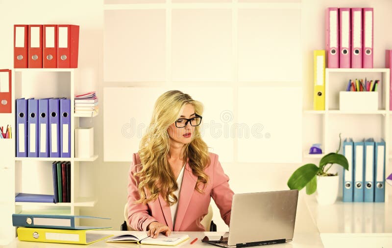 Be professional. girl secretary in glasses. manager at work. confident businesswoman. lady boss. sexy blonde at table