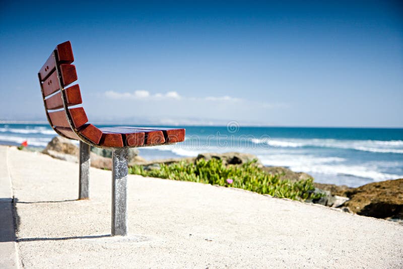 Empty Bench by the Beach