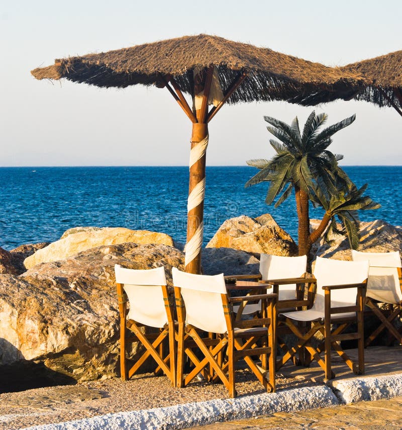Cafe on a Beach stock image. Image of chair, parasol, greece 6622705
