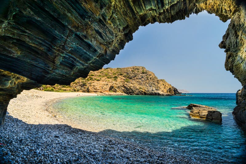 Beach with Cave. Well known beautiful Almiro beach with a cave at the Mani Peninsula on Peloponnese, Greece Beach with Cave. Well known beautiful Almiro beach with a cave at the Mani Peninsula on Peloponnese, Greece