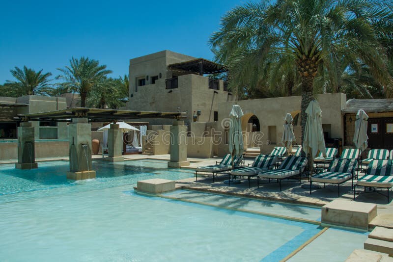 Beach chairs area near swimming pool at luxury arabic desert resort royalty free stock photography Beach chairs area near swimming pool at luxury arabic desert resort royalty free stock photography