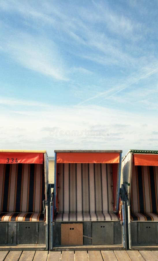 Beach-chairs in front of the sky