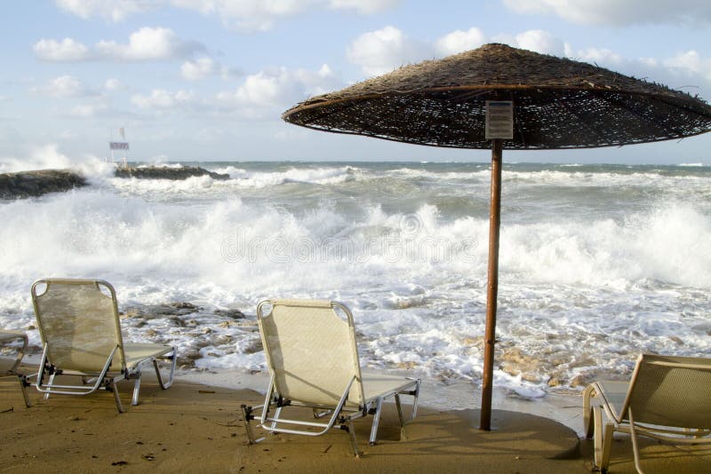 Three Chairs and a Sun Canopy on a Stormy Beach Stock Image Image of