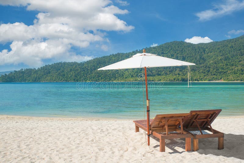 Beach Chairs and Umbrella on island in Phuket, Thailand