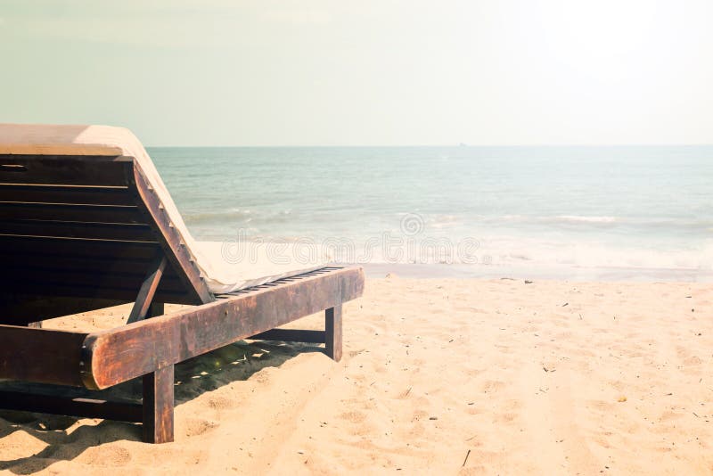 Beach with chaise lounge stock photos