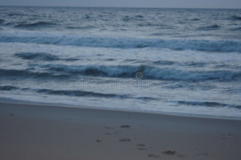 Sunrise on the ocean, white sky, and sand royalty free stock images Sunrise on the ocean, white sky, and sand royalty free stock images