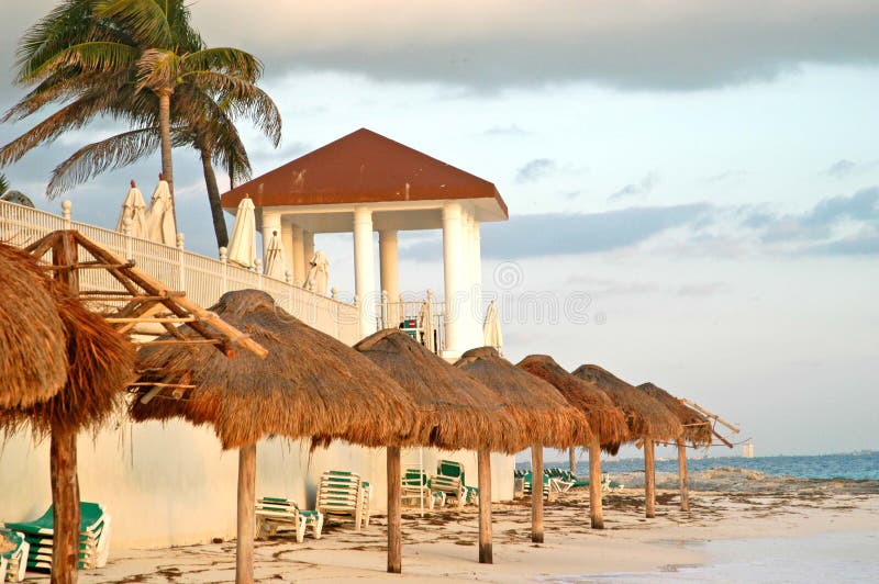 Beach green chairs blue ocean and umbrellas 3