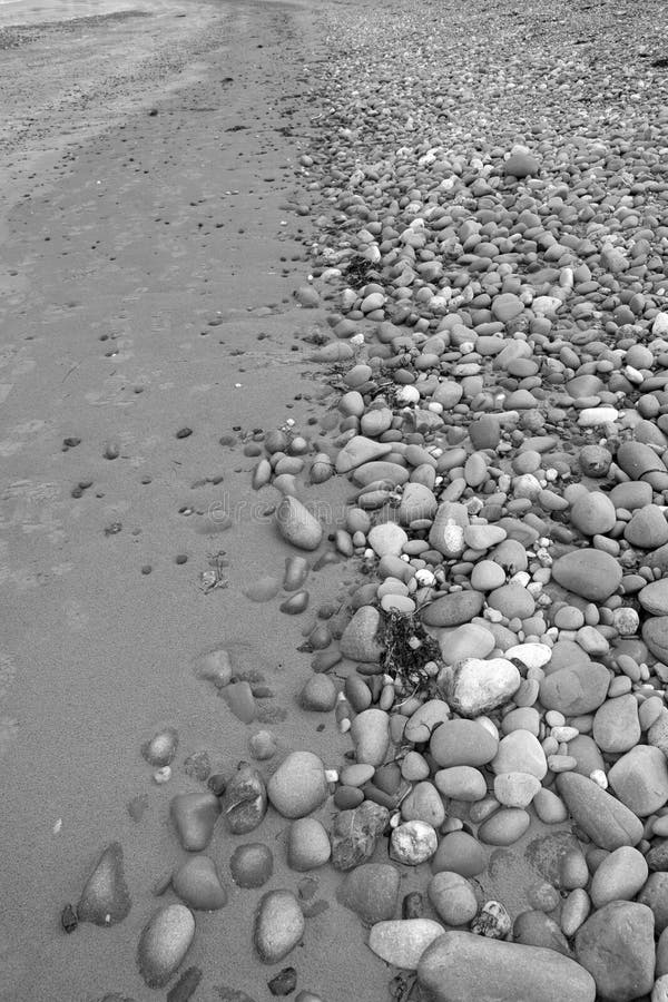 Beach of grey pebbles and rocks