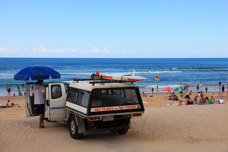 Lifeguard with car at beach scenery