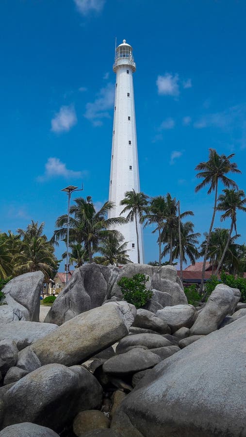 Beach with lighthouse tower, Lengkuas Island, Belitung, Indonesia