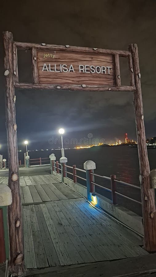 View of industrial lights at night seen from the hotel& x27;s beach pier. Industrial lights stock images, royalty-free photos and pictures