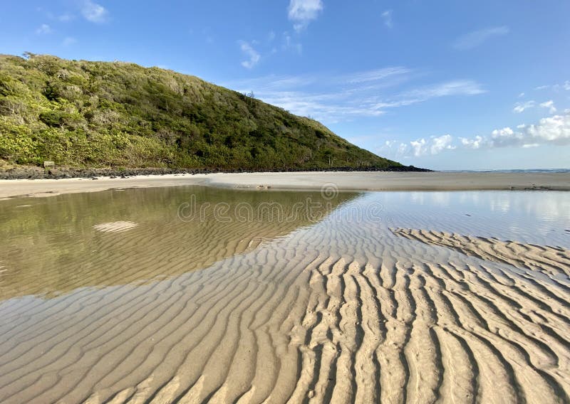 A beach and sand ripples at low tide on the Gold Coast in Queensland, Australia