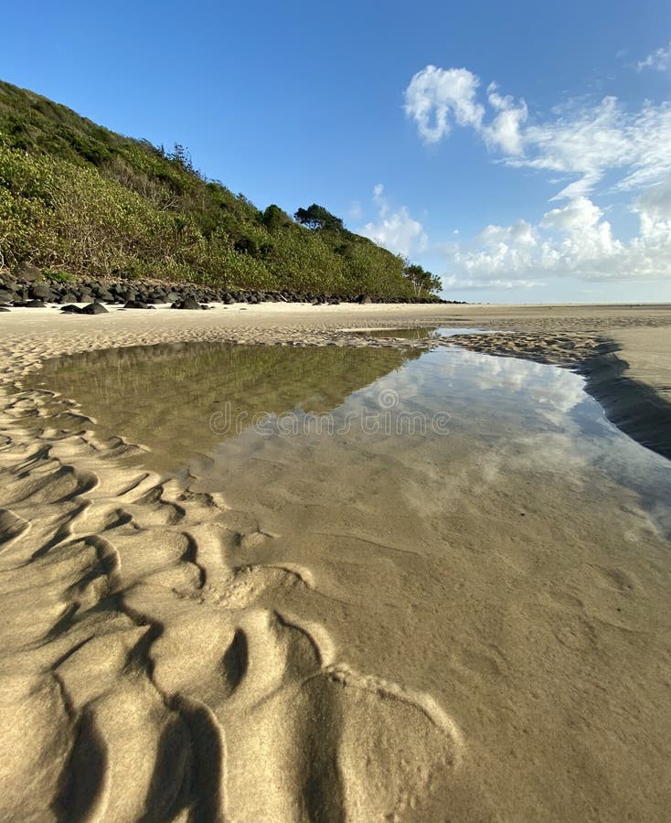 A beach and sand ripples at low tide on the Gold Coast in Queensland, Australia