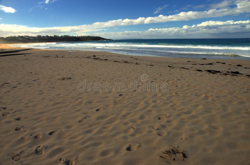 A beach in shadow