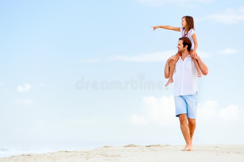 Beach stroll family