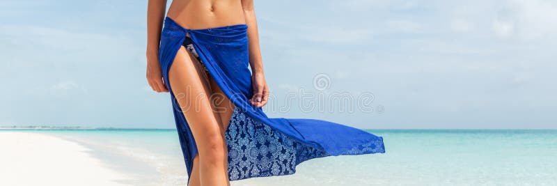 Beach summer body woman banner. Skin care leg laser epilation hair removal sexy legs in fashion blue pareo skirt wrap women. Luxury travel panorama copy space crop.