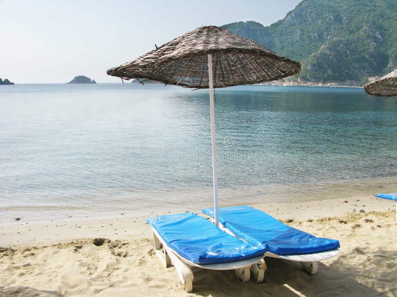 Beach with sun-tents and sun-beds