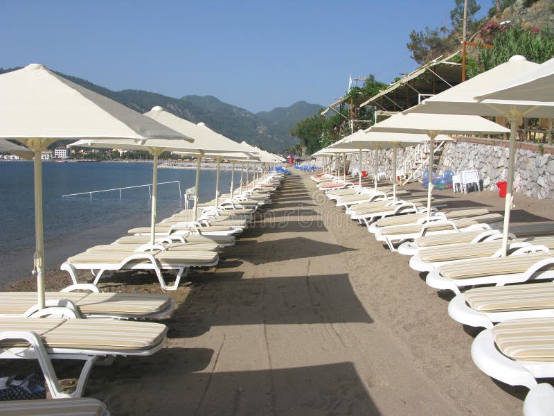 Beach with sun-tents and sun-beds