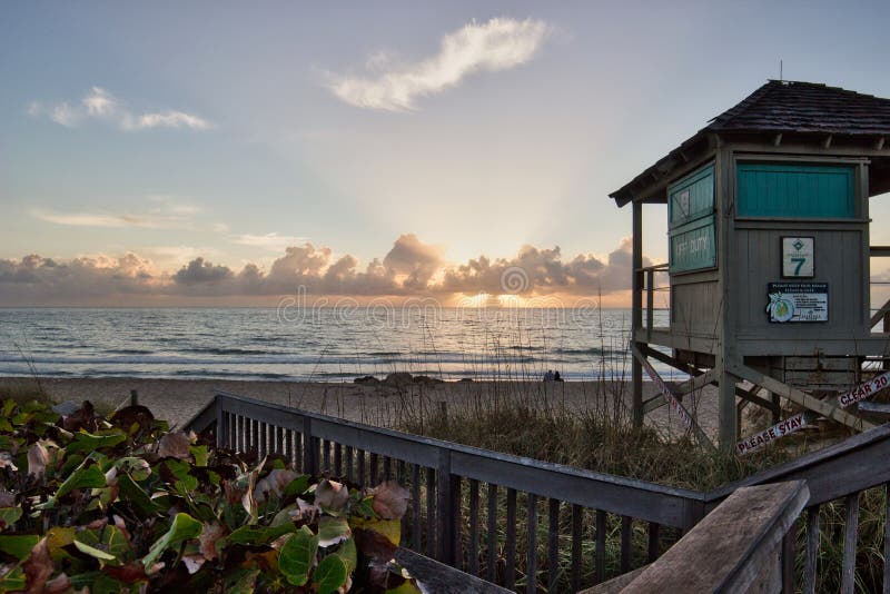 Beach Sunrise with Lifeguard tower royalty free stock photography