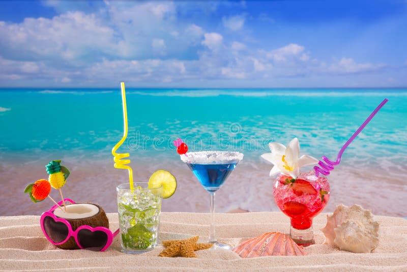 Beach tropical cocktails on white sand mojito blue hawaii