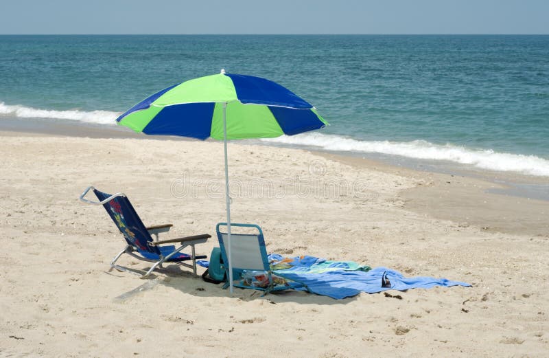 Beach Umbrella and Chair by Ocean