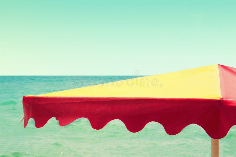 Beach Umbrella on the Sea Background, Vintage Retro Style Stock Image