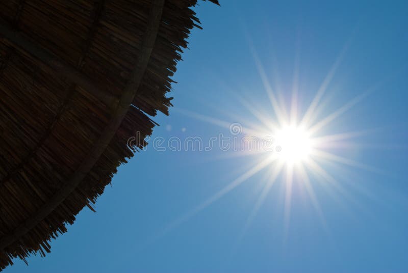 Beach umbrella and sun