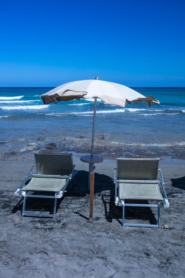 Beach Umbrellas and Deckchairs Near the Sea Stock Photo Image of