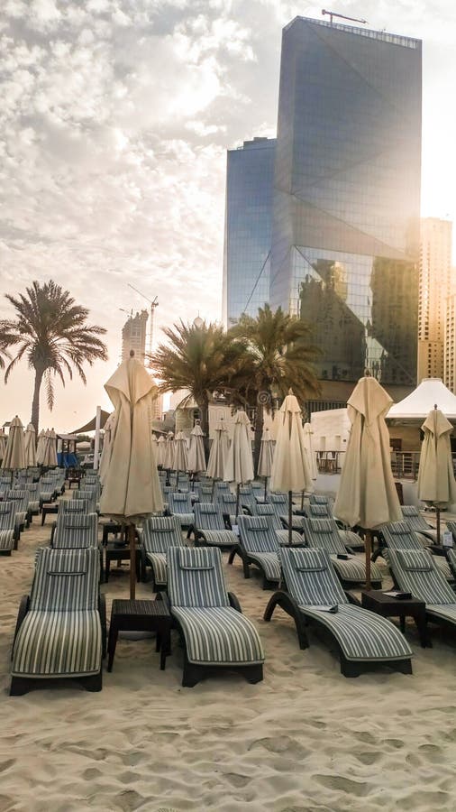 Beach with Umbrellas in Dubai in the Evening. UAE. September 2018 Stock