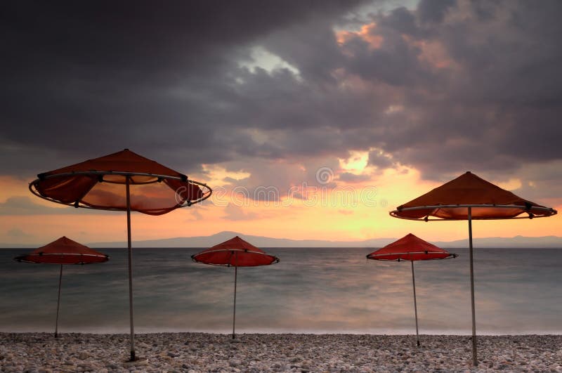 Beach Umbrellas on a Windy Day Stock Photo Image of greece, dramatic