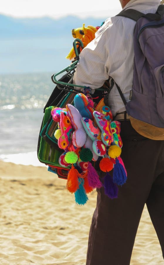A Colorful Beach Vendor Selling Butterflys stock photos A Colorful Beach Vendor Selling Butterflys stock photos