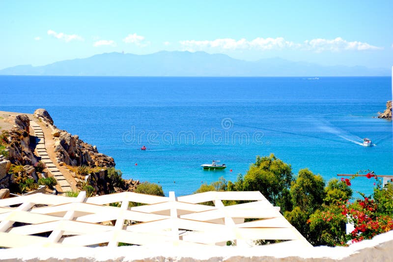 Beach view from a window. Mykonos, Greece.