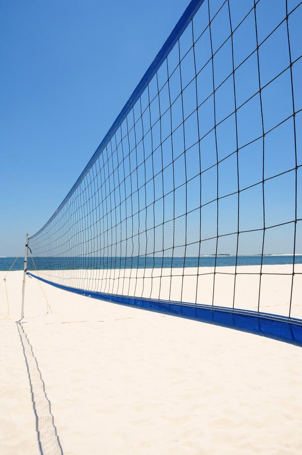 Volleyball net set up on beautiful white beach under blue sky. Volleyball net set up on beautiful white beach under blue sky
