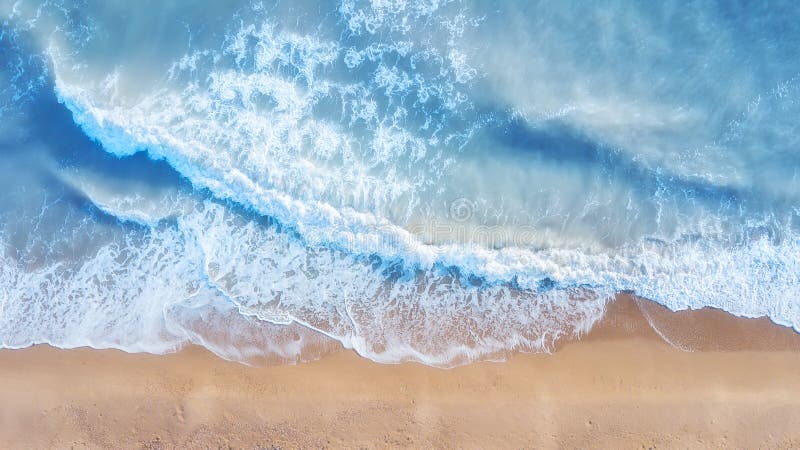 Beach and waves from top view. Summer seascape from air. Top view from drone.