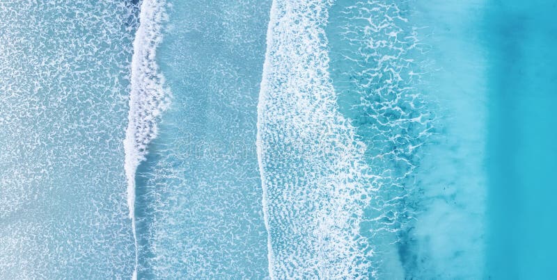 Beach and waves from top view. Turquoise water background from top view.