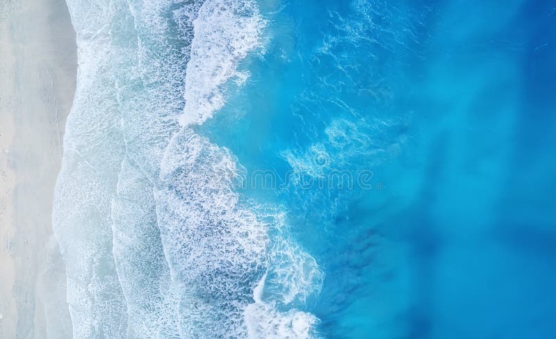 Beach and waves from top view. Turquoise water background from top view. Summer seascape from air. Top view from drone.