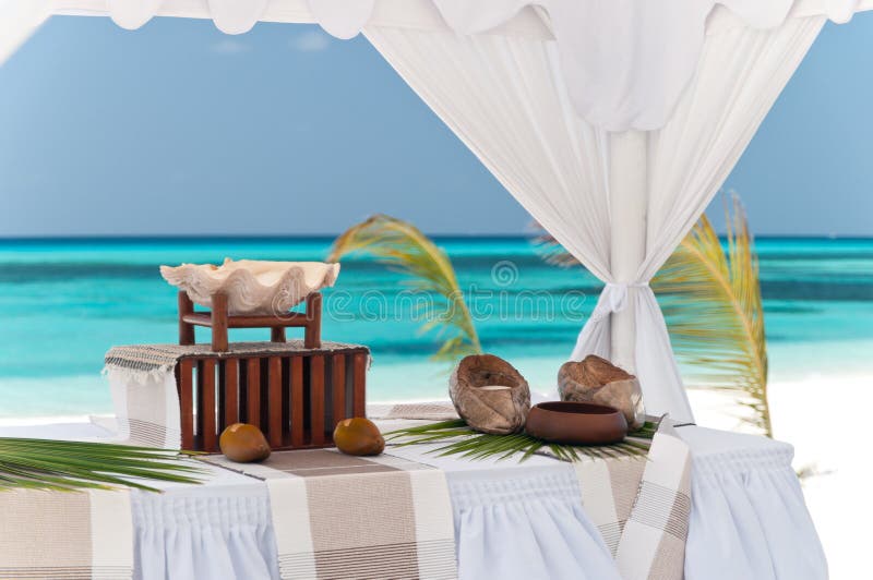 Decorated altar in a beach wedding tent on the maldives