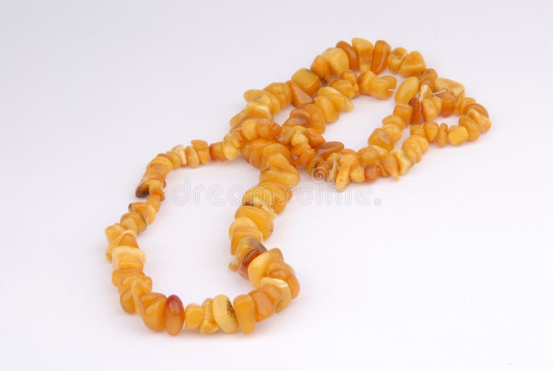 Beads, necklace of amber on white