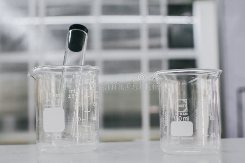Beaker and Test Tubes in Chemistry Science Laboratory Background. Stock
