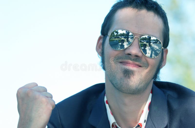 Beaming Young Man with Sunglasses stock images Beaming Young Man with Sunglasses stock images