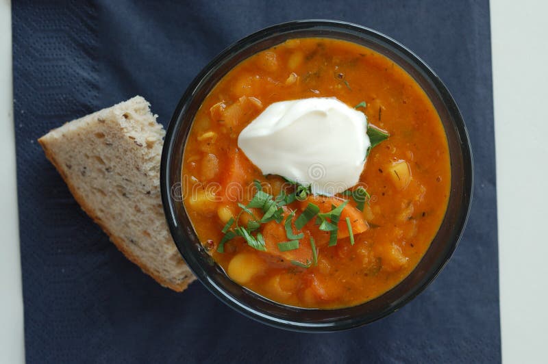 Bean soup in black bowl with grain bread royalty free stock image Bean soup in black bowl with grain bread royalty free stock image