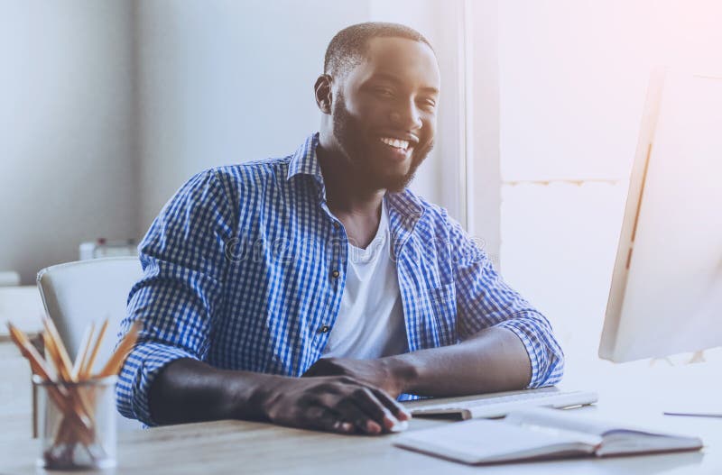 Beard Young Afro-american Man Working wih Computer stock image Beard Young Afro-american Man Working wih Computer stock image