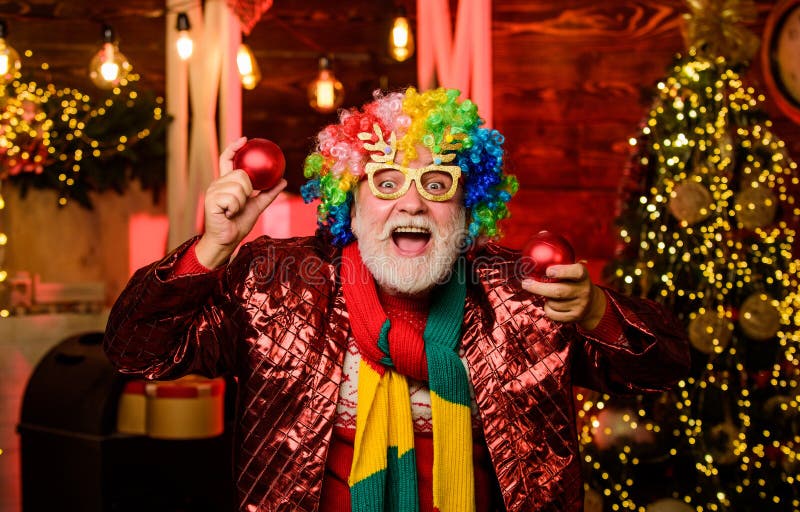 Bearded grandfather senior man celebrate christmas. Party entertainment. Christmas spirit. Cheerful clown colorful.