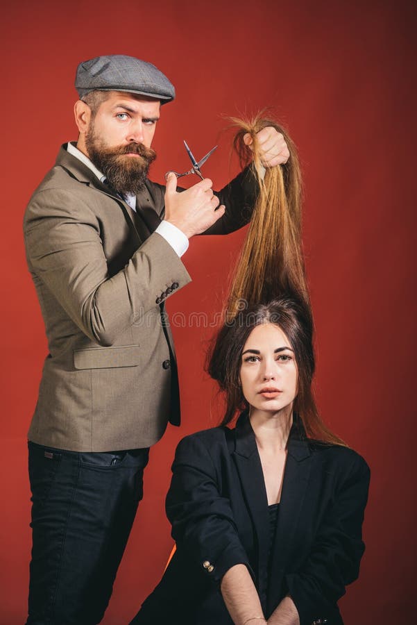 Bearded Hairdresser making hair styling and cut. Hairdressers work. Barber shop. Barbershop design. Barber scissors. royalty free stock photography Bearded Hairdresser making hair styling and cut. Hairdressers work. Barber shop. Barbershop design. Barber scissors. royalty free stock photography