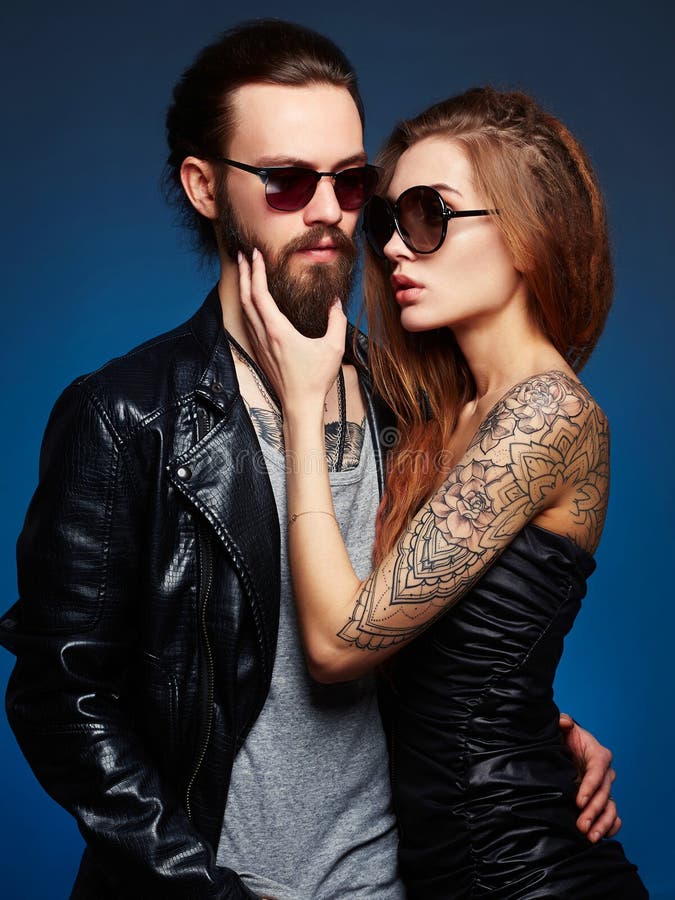 Bearded Hipster boy and beauty girl with tattoo